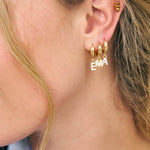 Little gold hoops with crystal initial charms