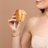 Pearl necklaces in a burger bun 