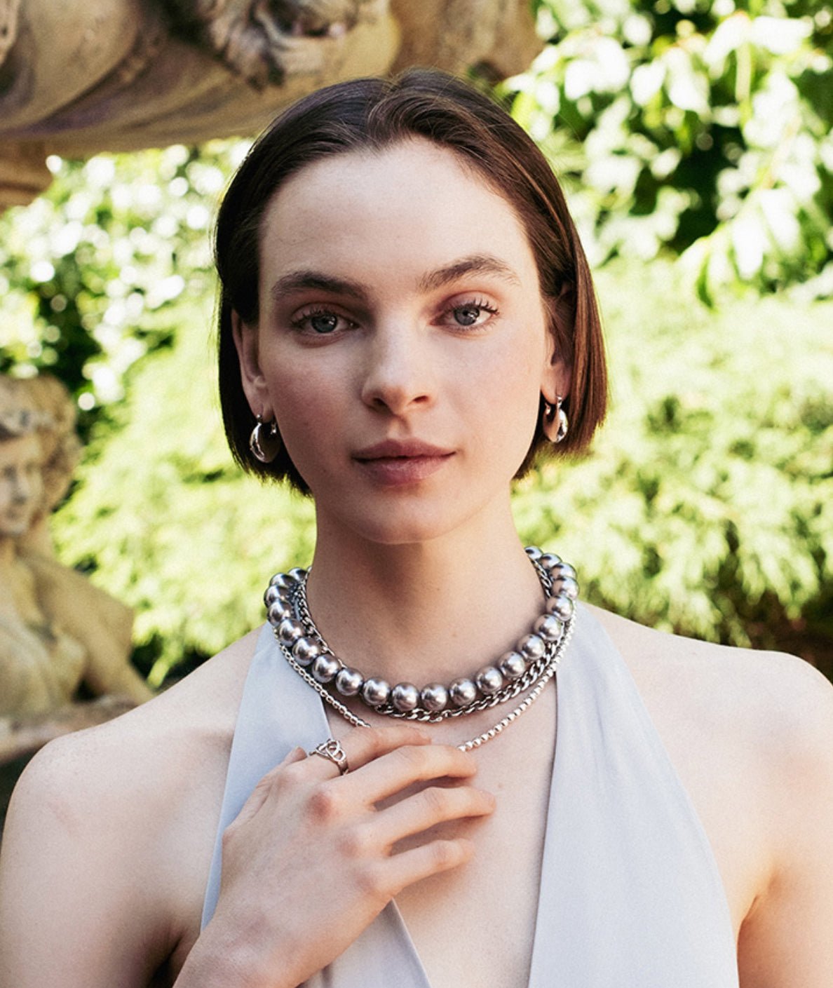 Model in dome shaped earrings 