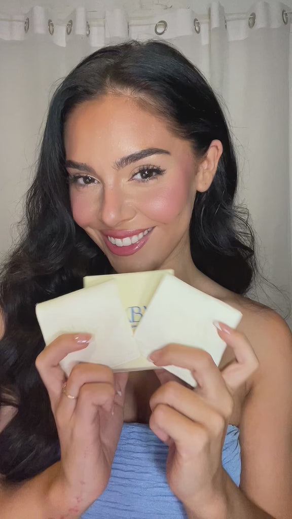 Influencer video styling the Puff Heart Earrings with a blue dress 