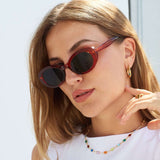Our model in new sunglasses and multicoloured hoops