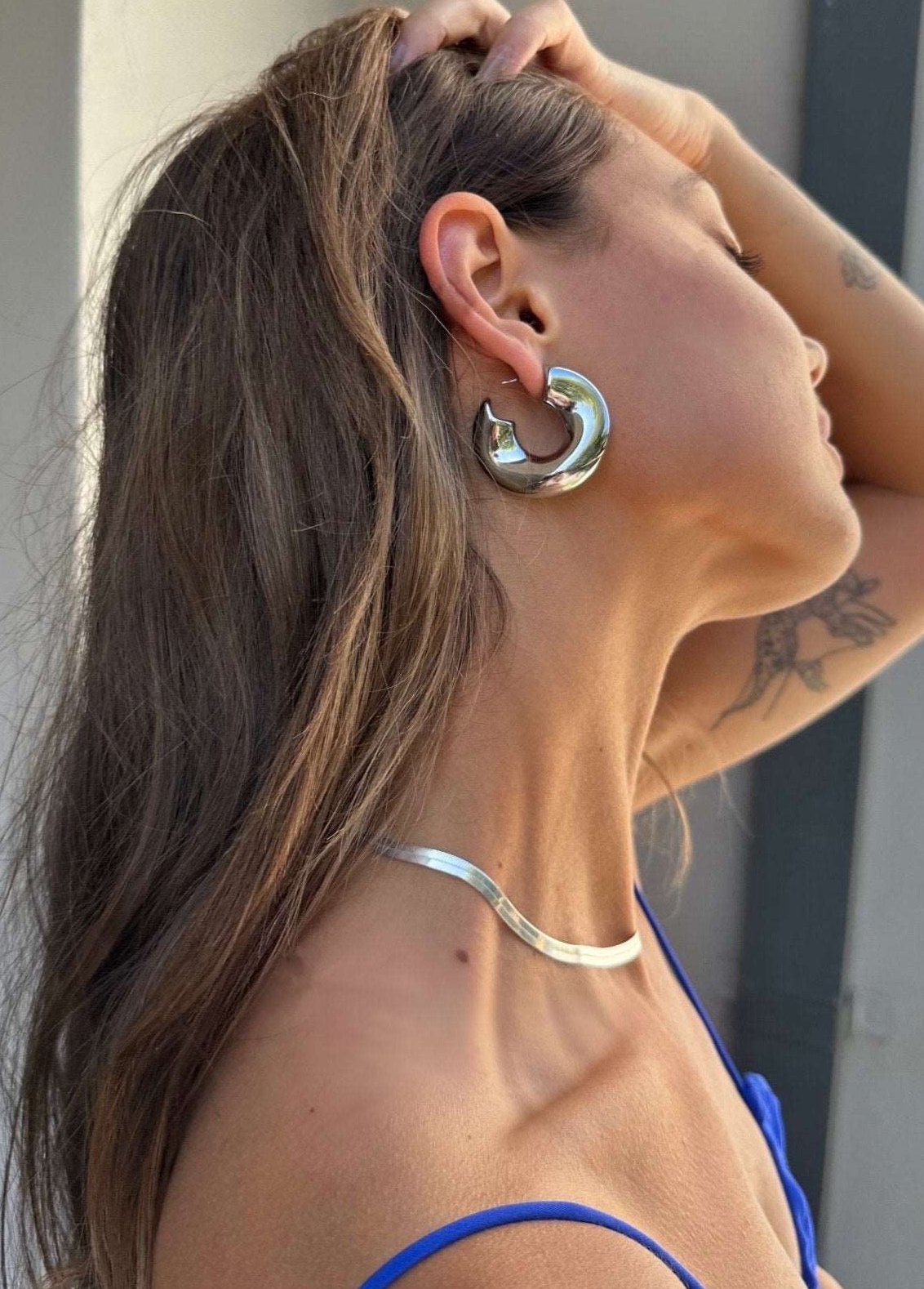 Model wearing our new big Swell hoops